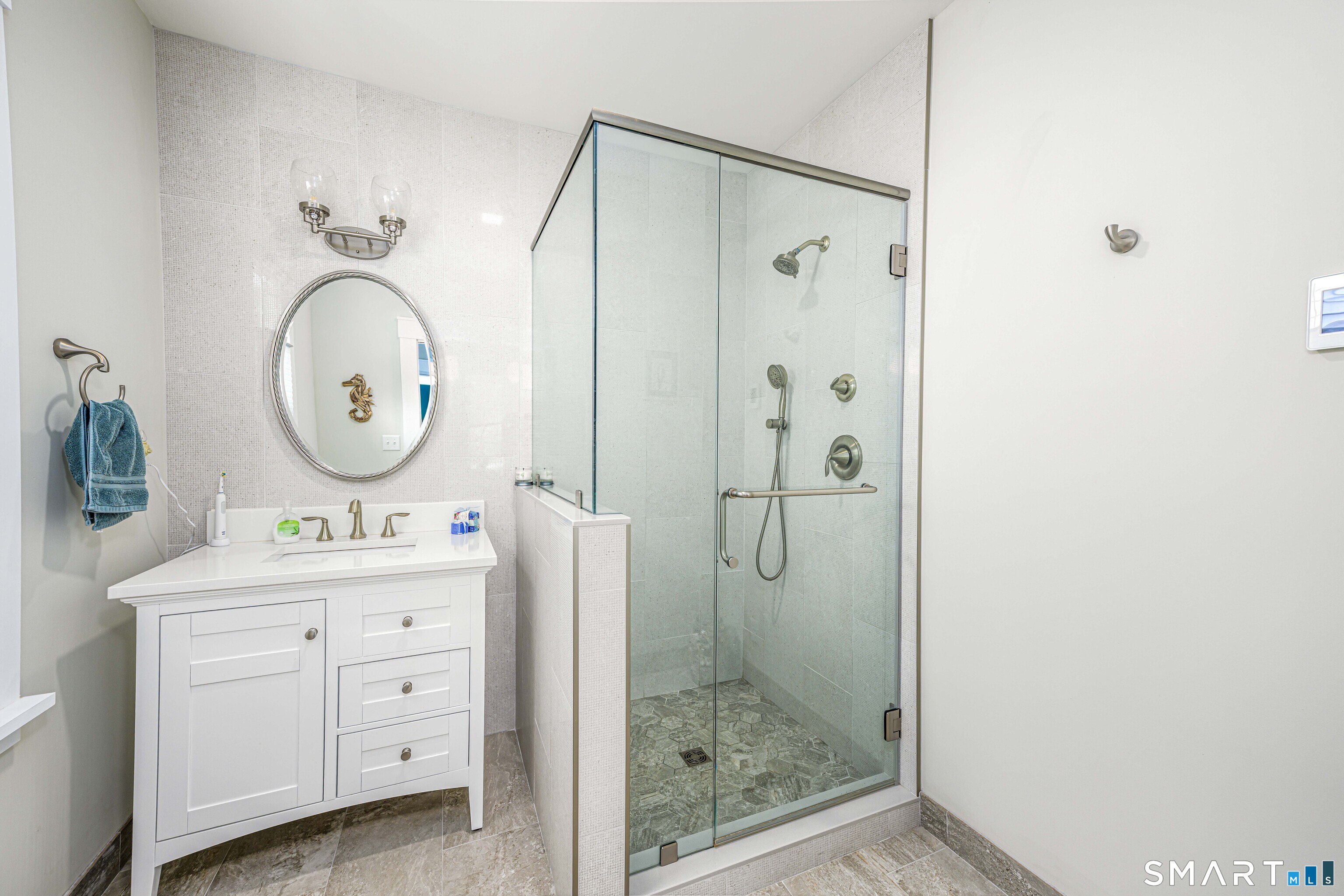77 Prospect Road East Haven, CT 06512 - Photo 11 of 31 Full bath on main level. FQuarts counter, radiant heated floor