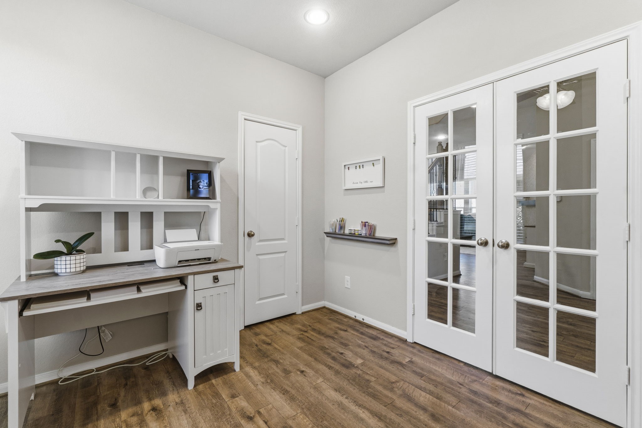 3900 Enchanted Timbers Lane Spring, TX 77386 - Photo 27 of 49 a view of a kitchen with cabinets and wooden floor