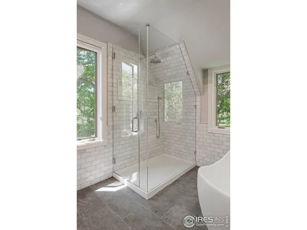 a bathroom with a shower and a sink