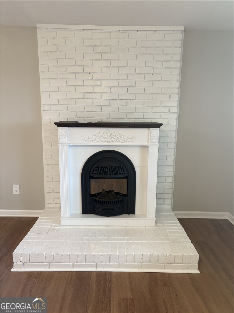 358 Misty Mills Road Lavonia, GA 30553 - Photo 3 of 7 a view of fireplace with wooden floor