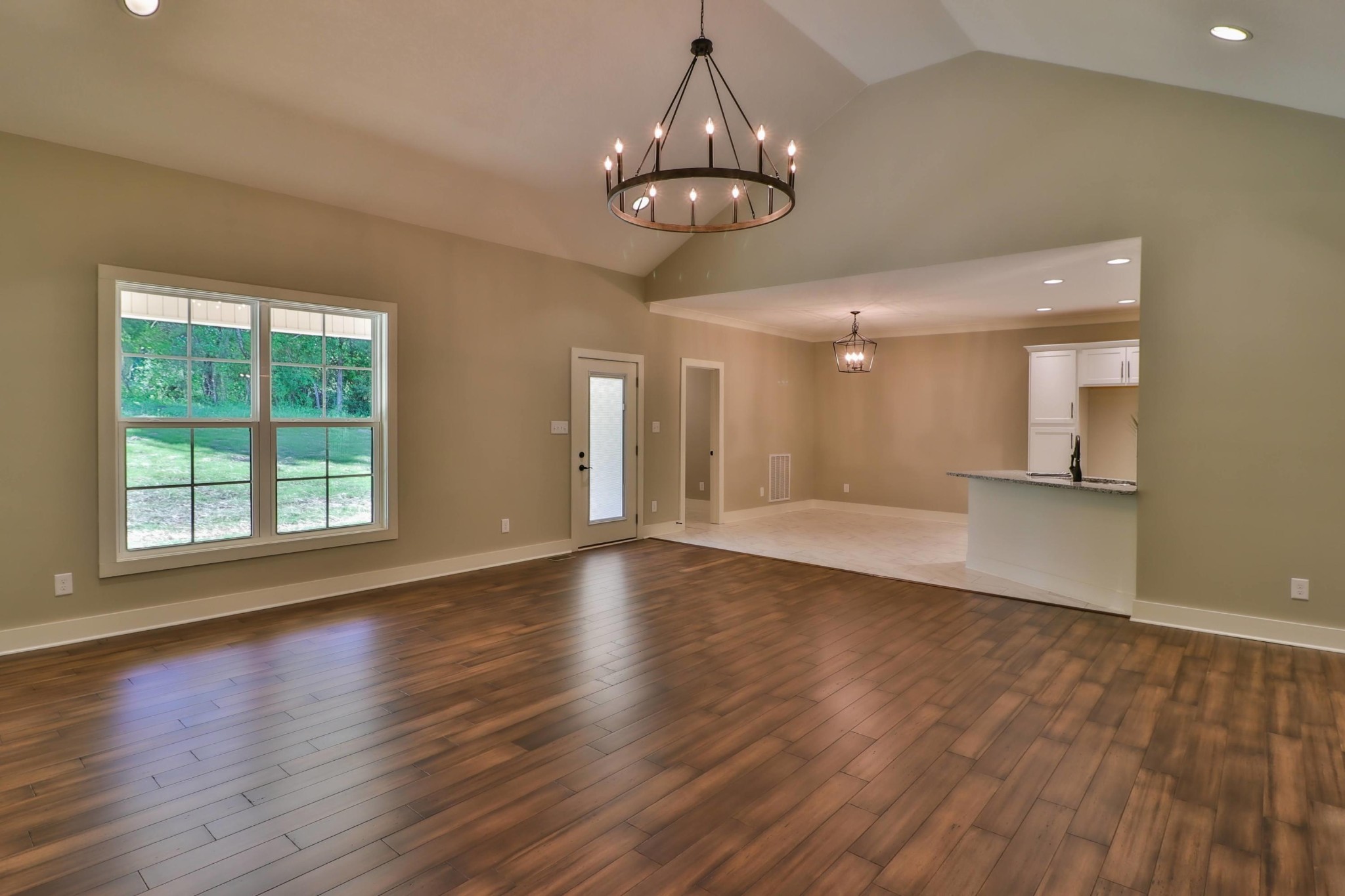 3423 West Wolf Valley Road Clinton, TN 37716 - Photo 9 of 34 a view of an empty room with wooden floor and a window