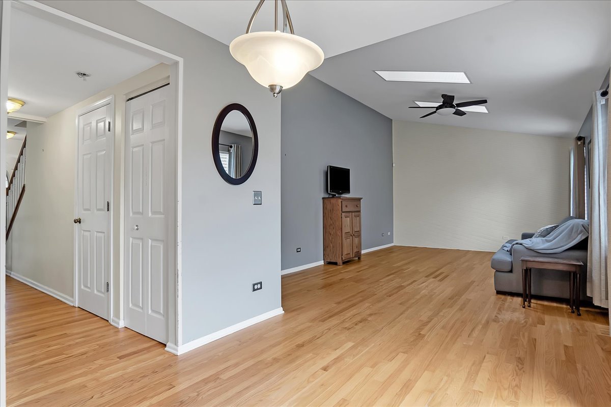2591 Smithfield Lane Aurora, IL 60503 - Photo 7 of 31 a view of a livingroom with furniture wooden floor and a chandelier