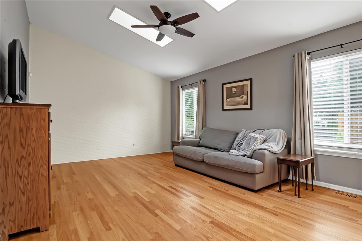 2591 Smithfield Lane Aurora, IL 60503 - Photo 9 of 31 a living room with furniture and a window
