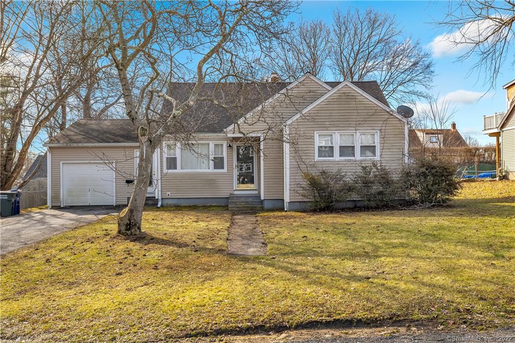 77 Loftus Circle Bridgeport, CT 06606 - Photo 1 of 1 a house that has a tree in front of it