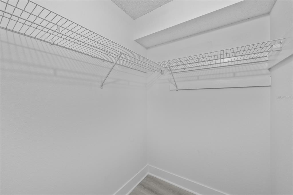 4775 Cove Circle, Unit 103 St. Petersburg, FL 33708 - Photo 17 of 61 a view of a room with racks on the wall