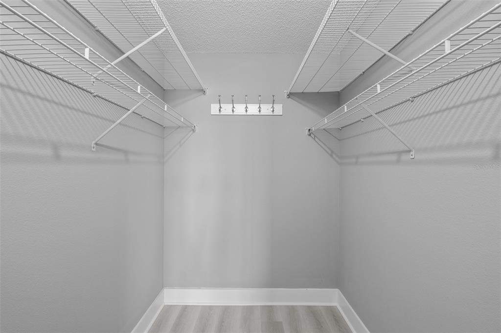 4775 Cove Circle, Unit 103 St. Petersburg, FL 33708 - Photo 21 of 61 a view of a room with racks on the wall
