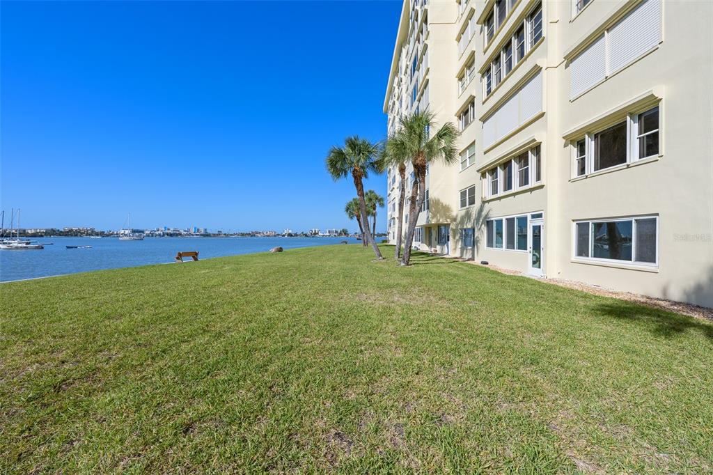 4775 Cove Circle, Unit 103 St. Petersburg, FL 33708 - Photo 33 of 61 a view of an house with backyard space and balcony