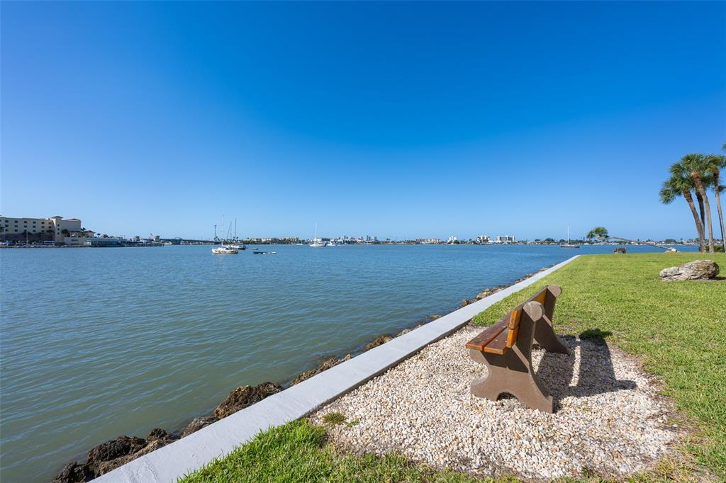4775 Cove Circle, Unit 103 St. Petersburg, FL 33708 - Photo 34 of 61 a view of a lake with a outdoor space
