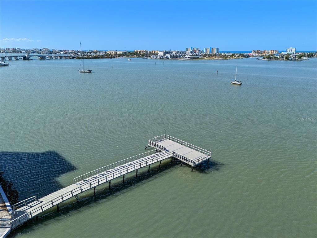 4775 Cove Circle, Unit 103 St. Petersburg, FL 33708 - Photo 37 of 61 a view of a lake with boats and city view