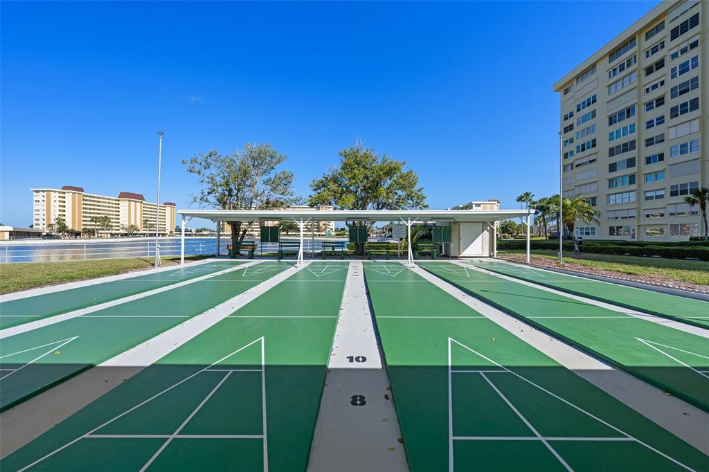 4775 Cove Circle, Unit 103 St. Petersburg, FL 33708 - Photo 41 of 61 a view of a tennis court
