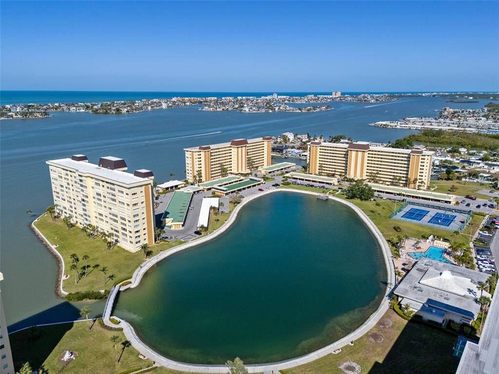 4775 Cove Circle, Unit 103 St. Petersburg, FL 33708 - Photo 52 of 61 a view of a swimming pool with an ocean view