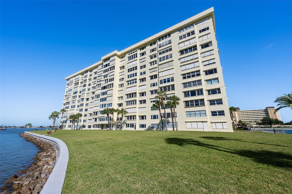 4775 Cove Circle, Unit 103 St. Petersburg, FL 33708 - Photo 53 of 61 a view of building with outdoor space