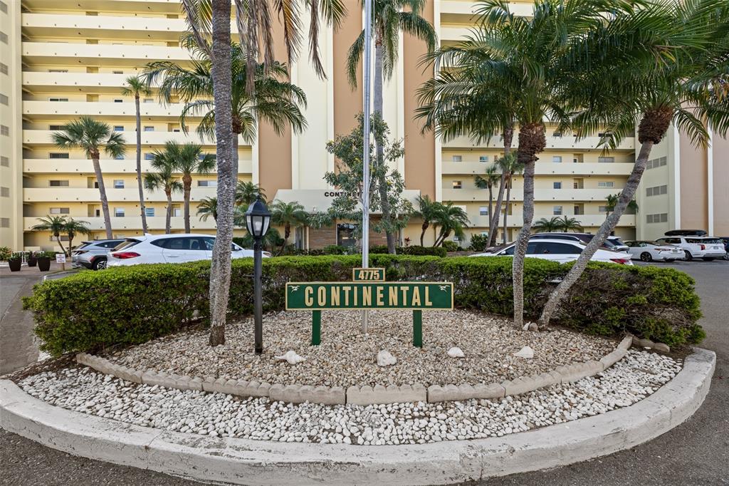 4775 Cove Circle, Unit 103 St. Petersburg, FL 33708 - Photo 57 of 61 a view of a park with a bench and trees
