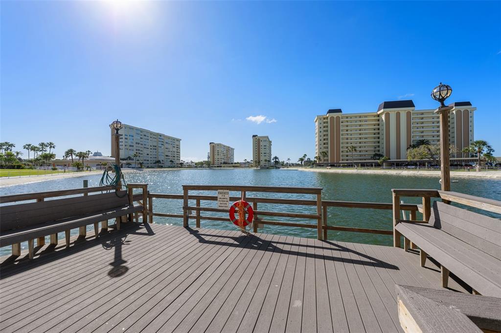 4775 Cove Circle, Unit 103 St. Petersburg, FL 33708 - Photo 60 of 61 a view of outdoor space with seating