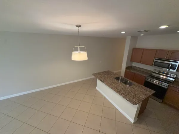 a view of house with yard and entertaining space