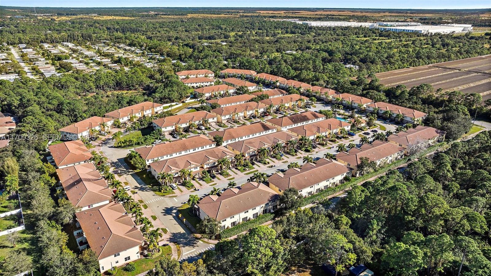 9491 Southwest Merlin Court Stuart, FL 34997 - Photo 38 of 45 an aerial view of residential houses with outdoor space
