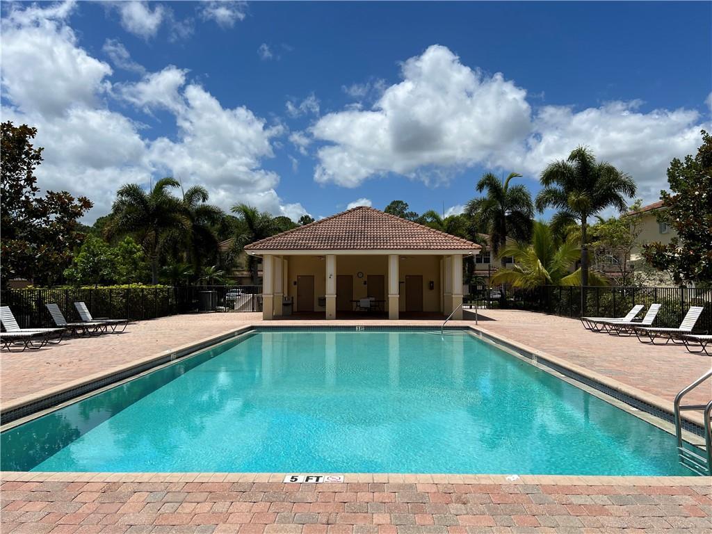 9491 Southwest Merlin Court Stuart, FL 34997 - Photo 43 of 45 a view of pool with yard in front of it