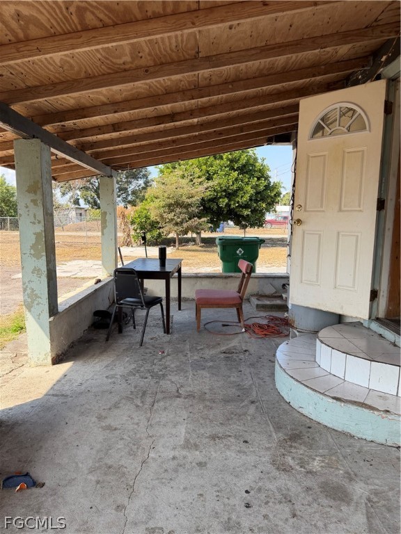 1274 Hookers Point Road Clewiston, FL 33440 - Photo 12 of 16 a view of a chairs and table in the patio