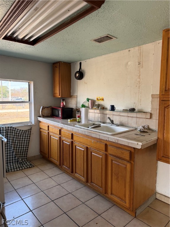 1274 Hookers Point Road Clewiston, FL 33440 - Photo 5 of 16 a kitchen with sink cabinets and window
