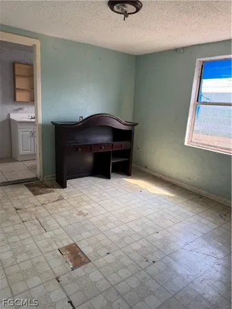 a view of a chairs and table in the patio