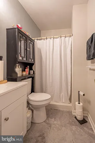 a bathroom with a sink toilet and vanity