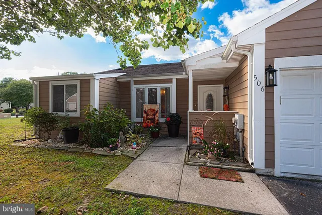 a view of house with patio outdoor seating area and entertaining space