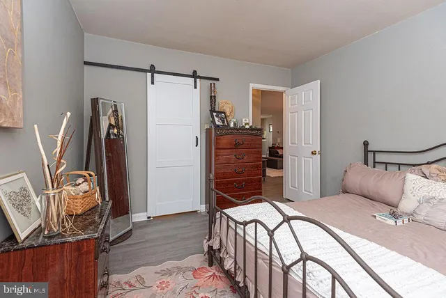 a bedroom with a bed and a closet