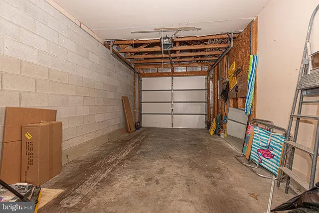 a view of walk in closet with clothes