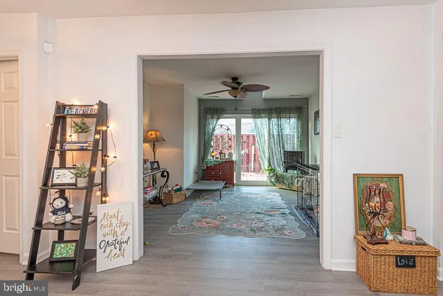 a view of a livingroom with wooden floor and toys