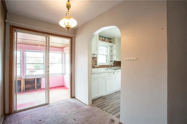 a room that has a bed and a chandelier