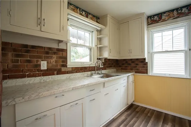 a kitchen with a sink and cabinets