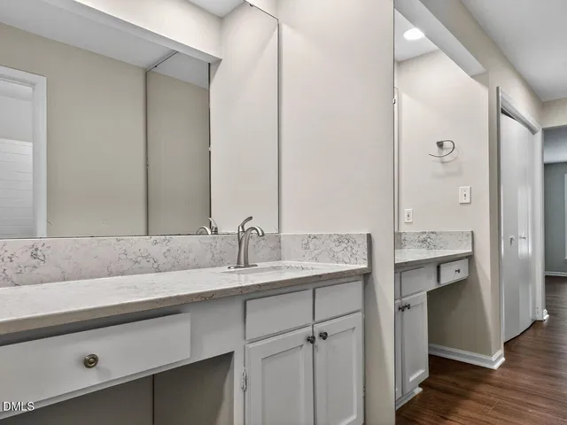 a view of wooden floor and windows in a room
