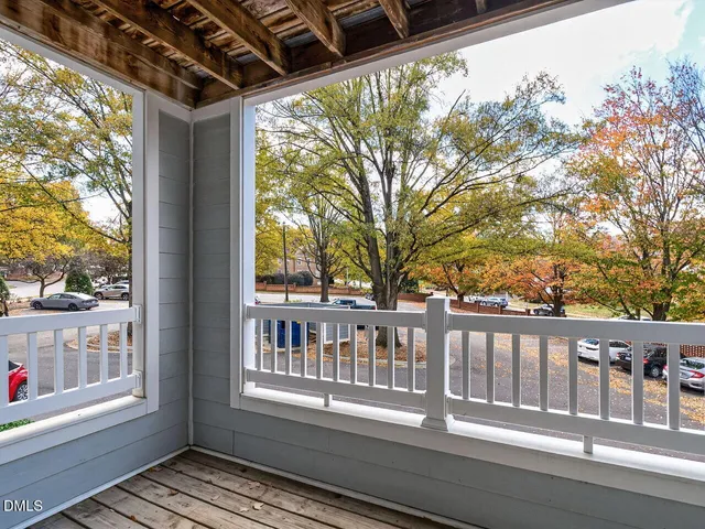 a view of a house with swimming pool and sitting area