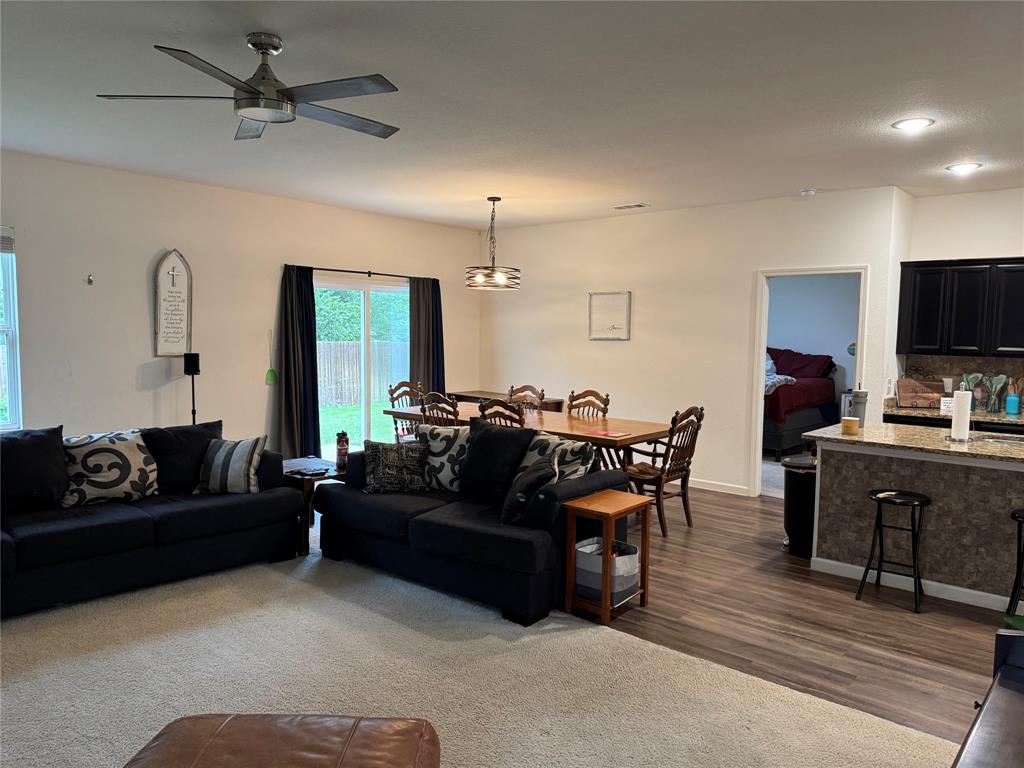 2209 Cinnamon Spgs Road Glenn Heights, TX 75154 - Photo 10 of 28 Open-concept living area featuring a ceiling fan with integrated lighting, wood-finish flooring, and recessed lighting