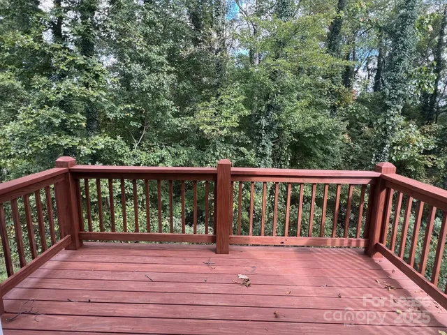 a view of balcony with wooden floor