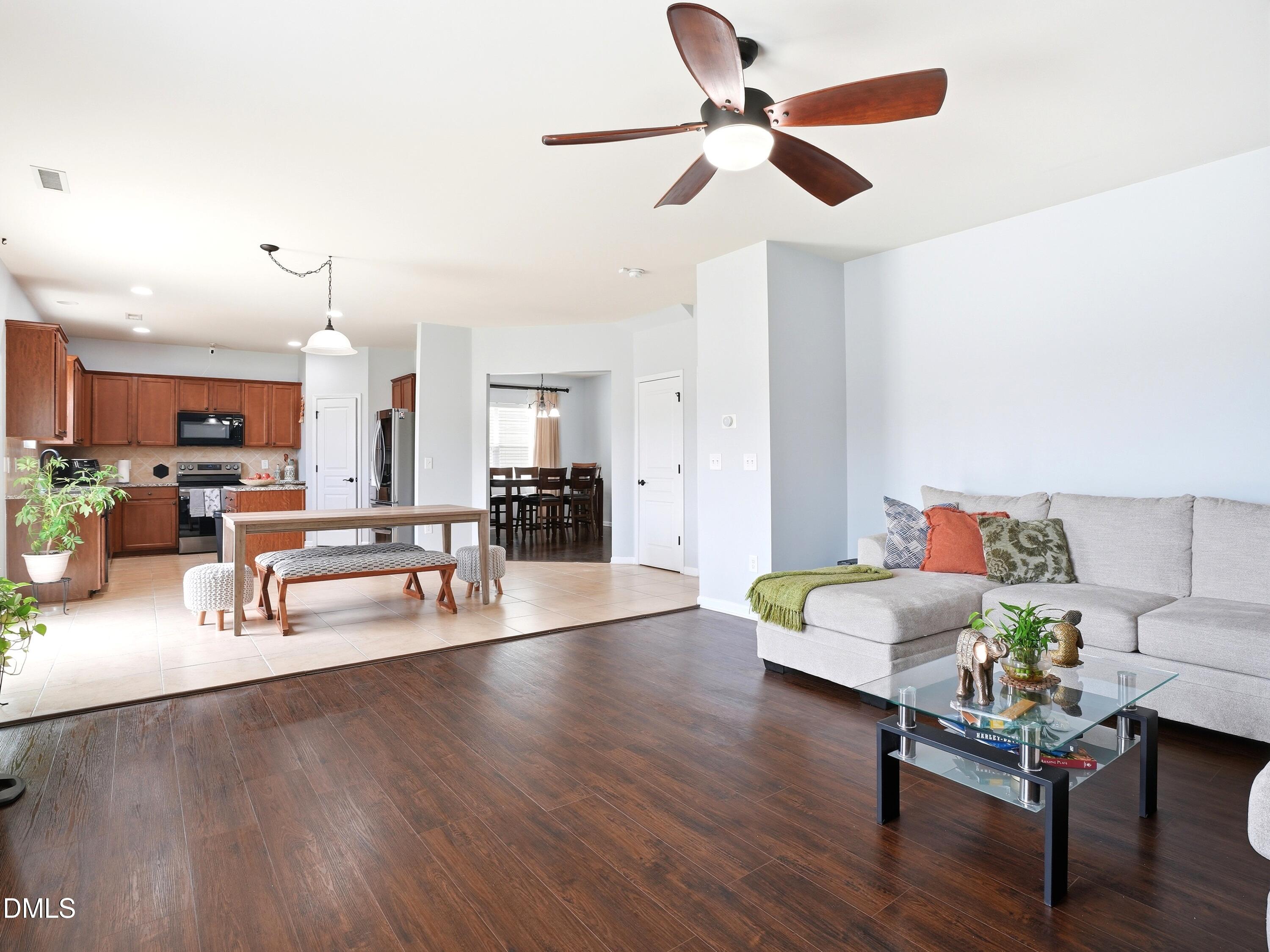 8128 Hovingham Way Raleigh, NC 27616 - Photo 10 of 40 a living room with furniture and kitchen view