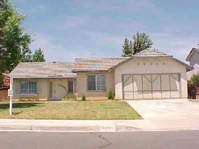 12744 Ponderosa Ranch Road Victorville, CA 92392 - Photo 1 of 1 a view of a white house with a outdoor space