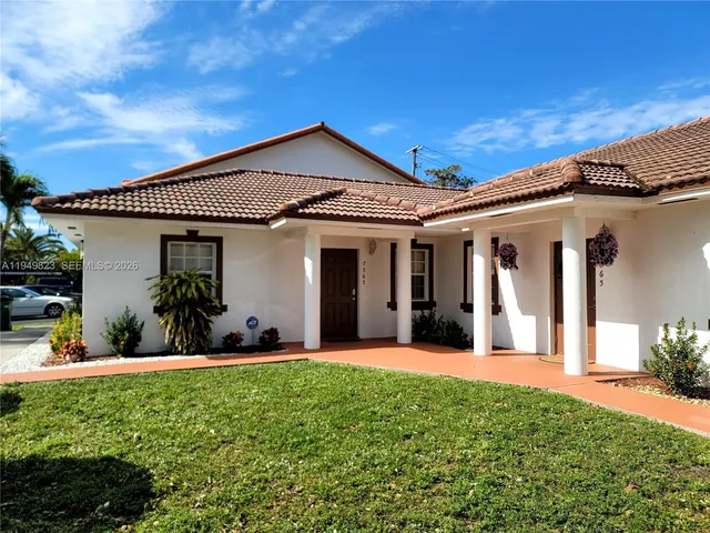 front view of a house with a yard