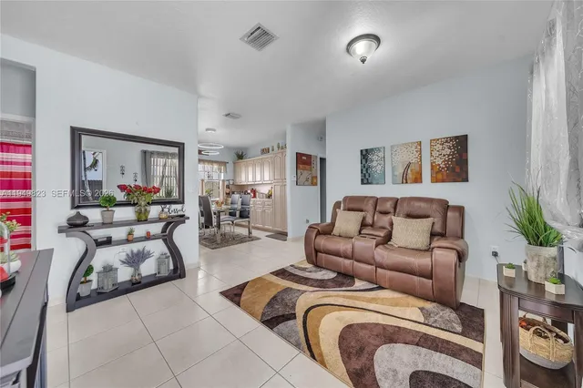 a living room with furniture and a couch