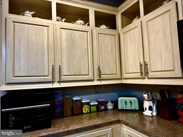 a living room with furniture a couch and a chandelier