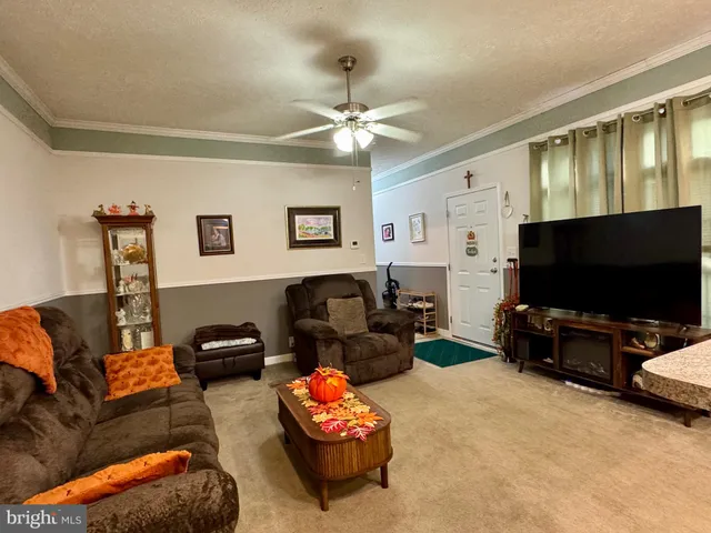 a bedroom with a bed and a flat tv screen