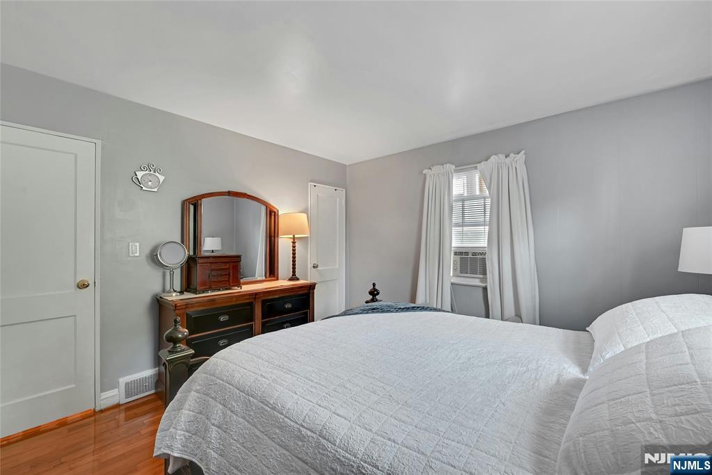 85 Edison Street Clifton, NJ 07013 - Photo 14 of 28 a bedroom with a bed and a table