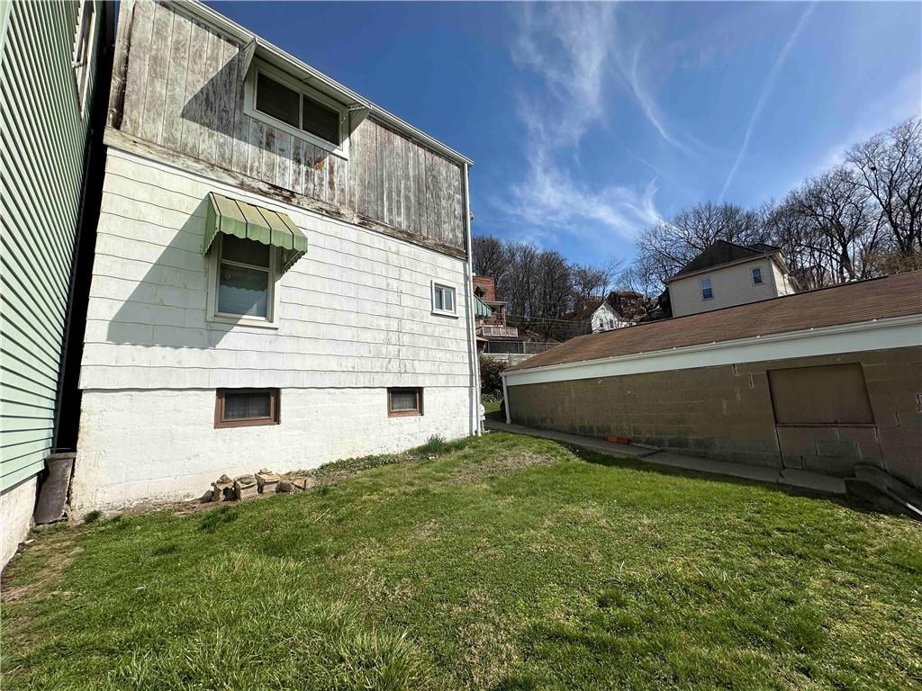 517 Ridge Avenue McKees Rocks, PA 15136 - Photo 7 of 38 a view of a backyard of the house