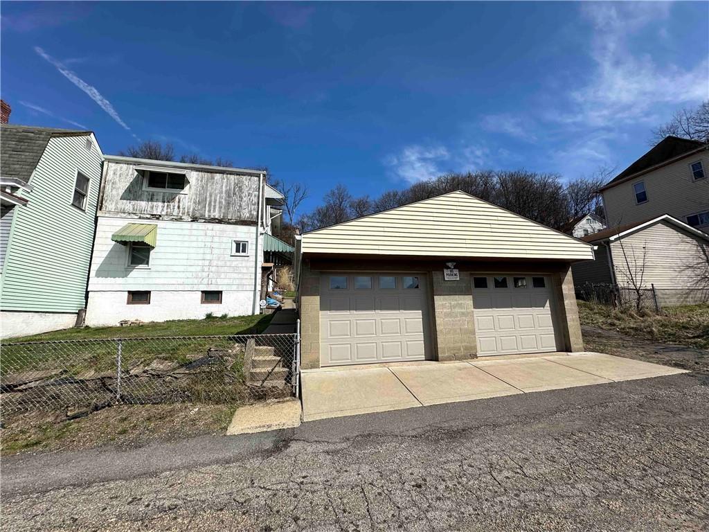 517 Ridge Avenue McKees Rocks, PA 15136 - Photo 8 of 38 a front view of a house with a yard