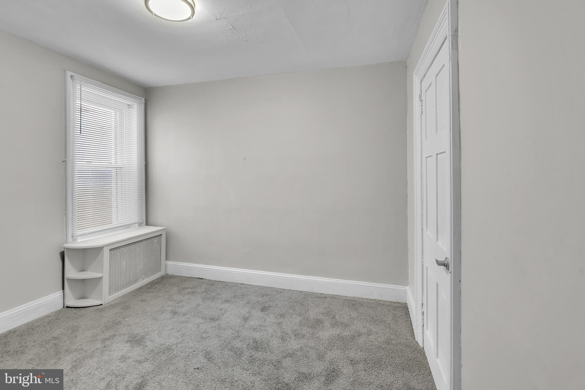 1419 Ellsworth Street Philadelphia, PA 19146 - Photo 15 of 17 an empty room with cabinet