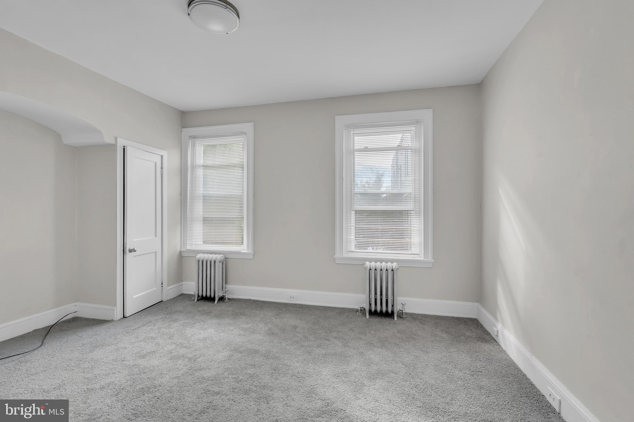 1419 Ellsworth Street Philadelphia, PA 19146 - Photo 16 of 17 an empty room with windows