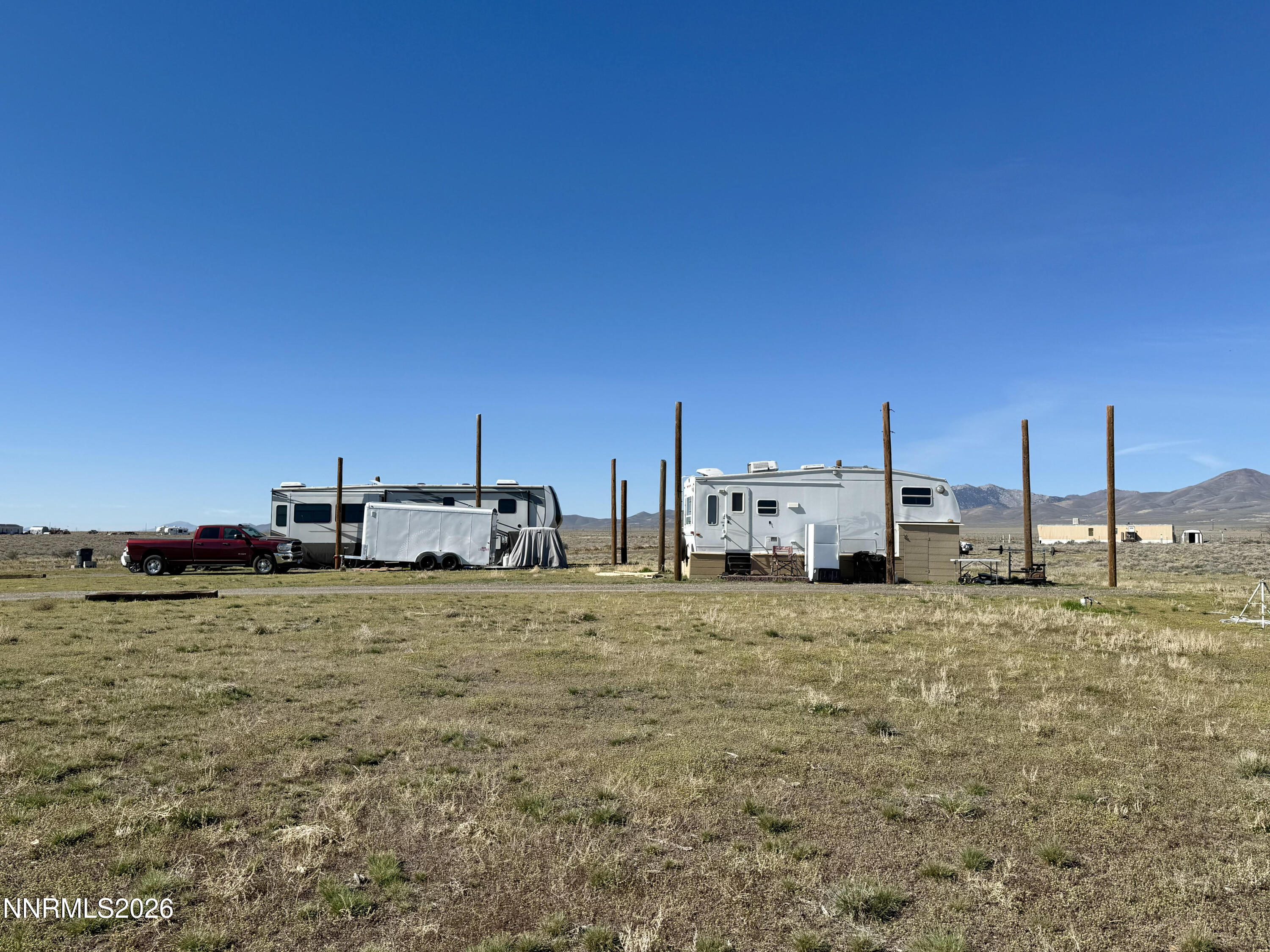 412 4th Street Crescent Valley, NV 89821 - Photo 20 of 34 a car parked in the middle of a field