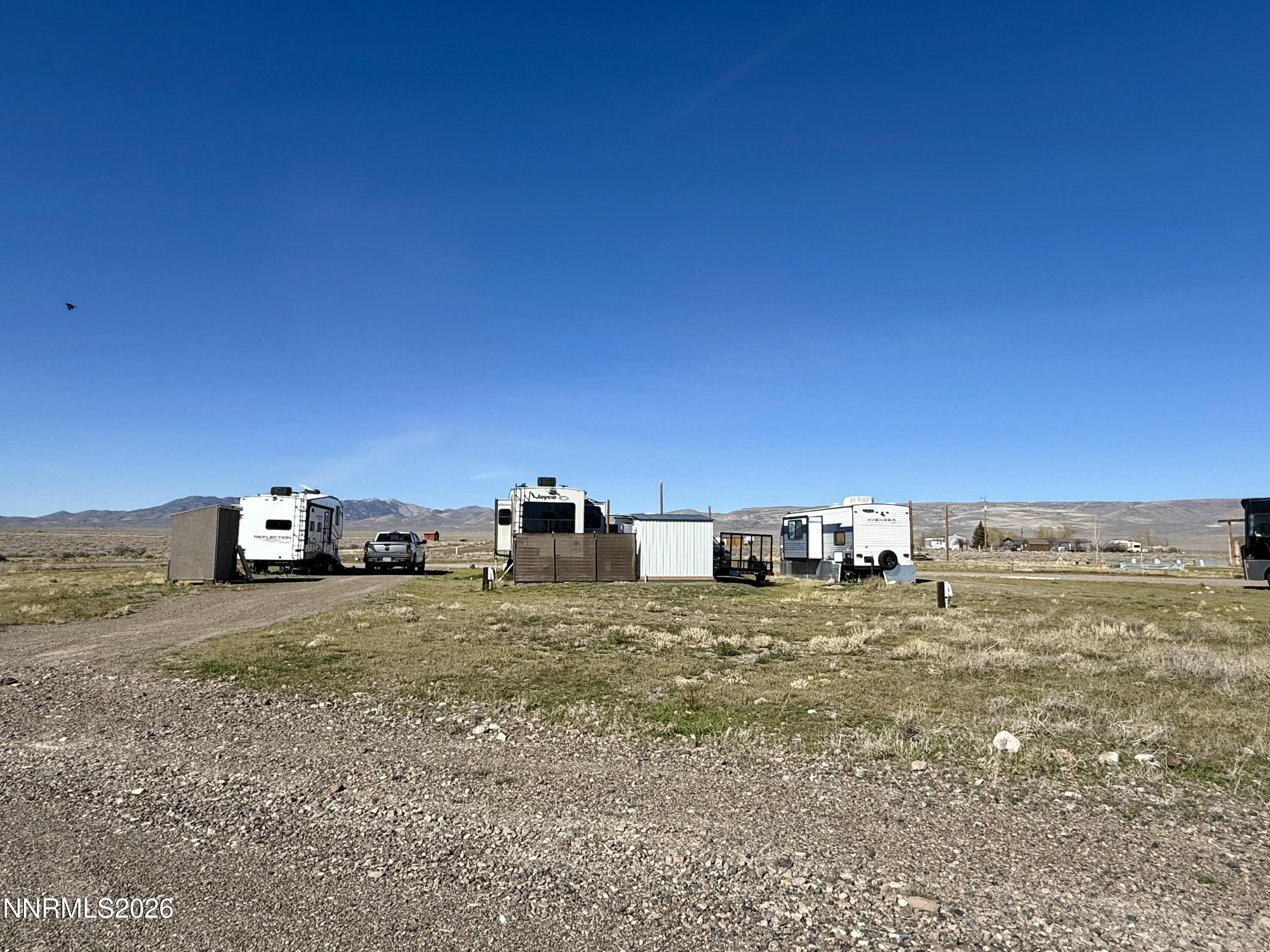 412 4th Street Crescent Valley, NV 89821 - Photo 8 of 34 a view of a dry yard with trees