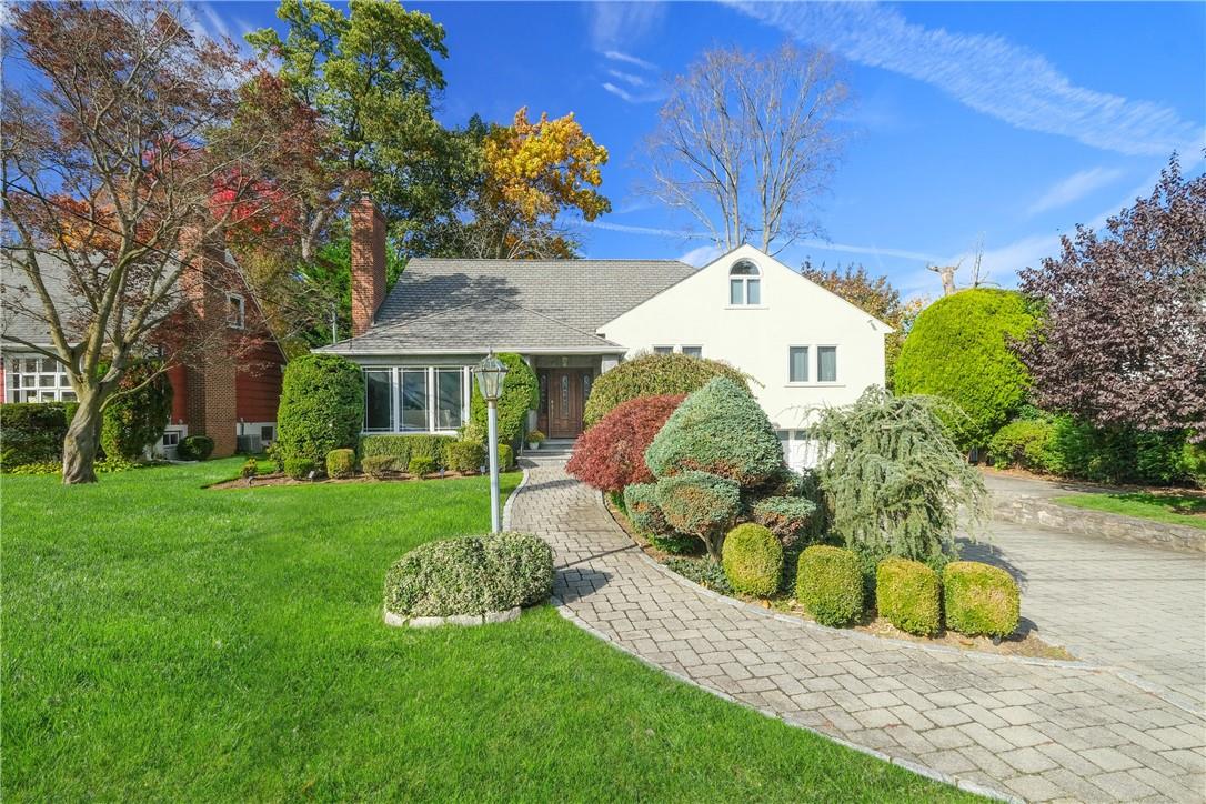 a front view of a house with garden