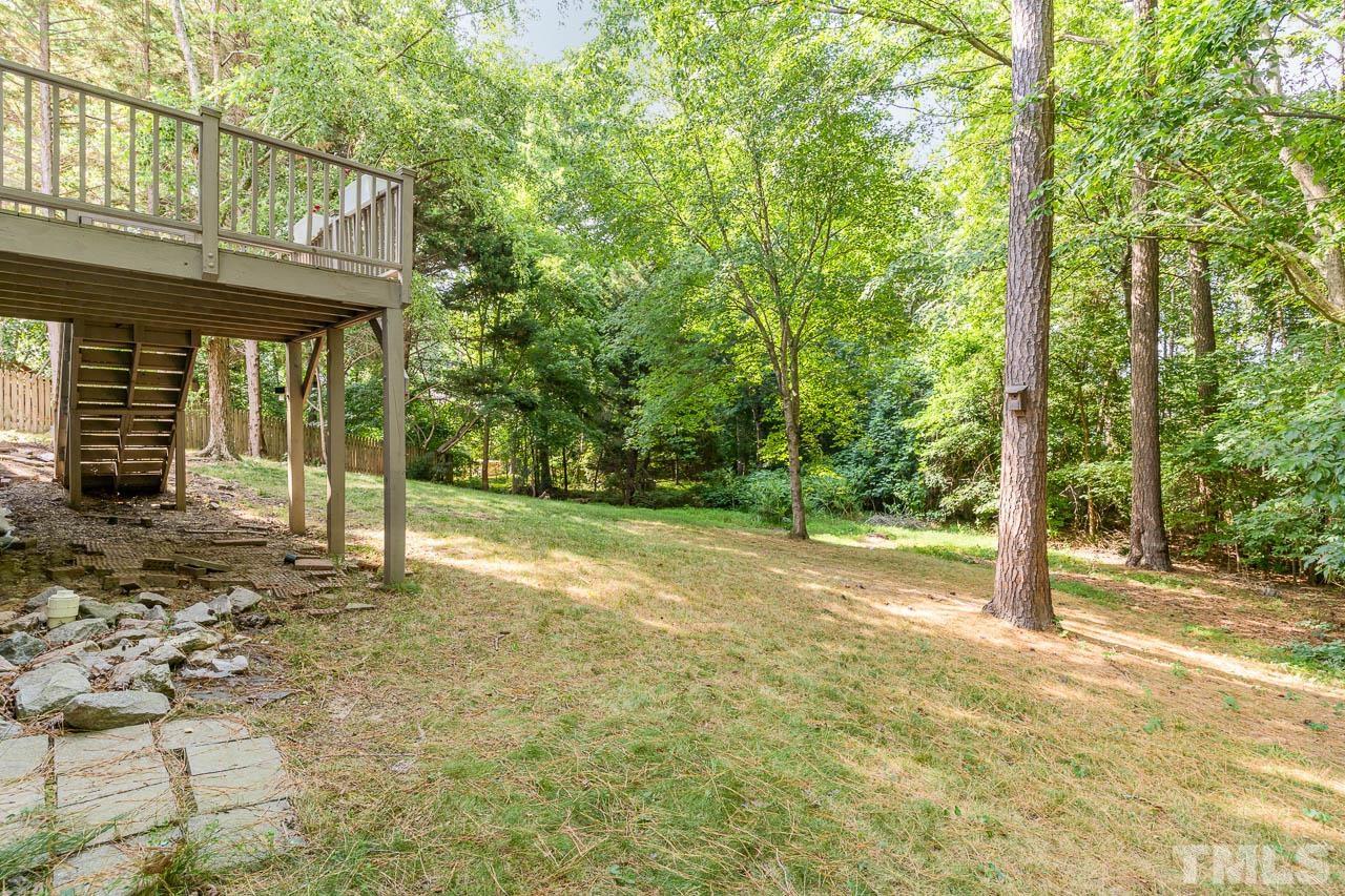2909 Englefield Drive Raleigh, NC 27615 - Photo 6 of 31 a view of a house with backyard and tree